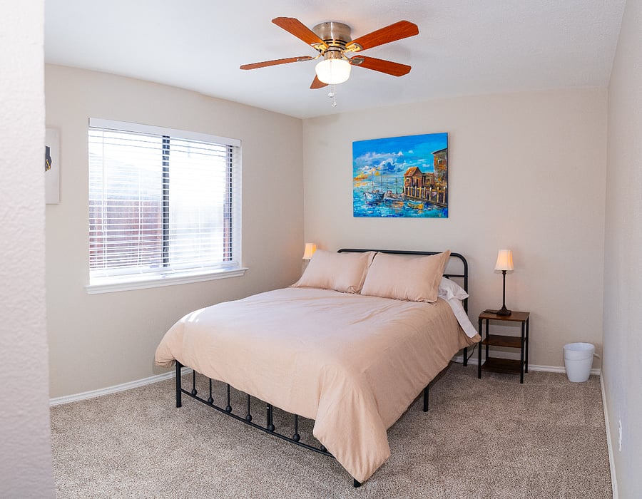 Roomy second bedroom with comfy full sized bed with bedside tables, lamps and multi plug for your convenience.