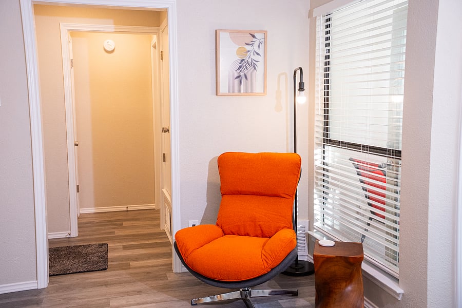 A comfy swivel chair with a reading light and views of the outdoors creates a cozy spot to read, rest, or listen to your favorite music or podcasts.