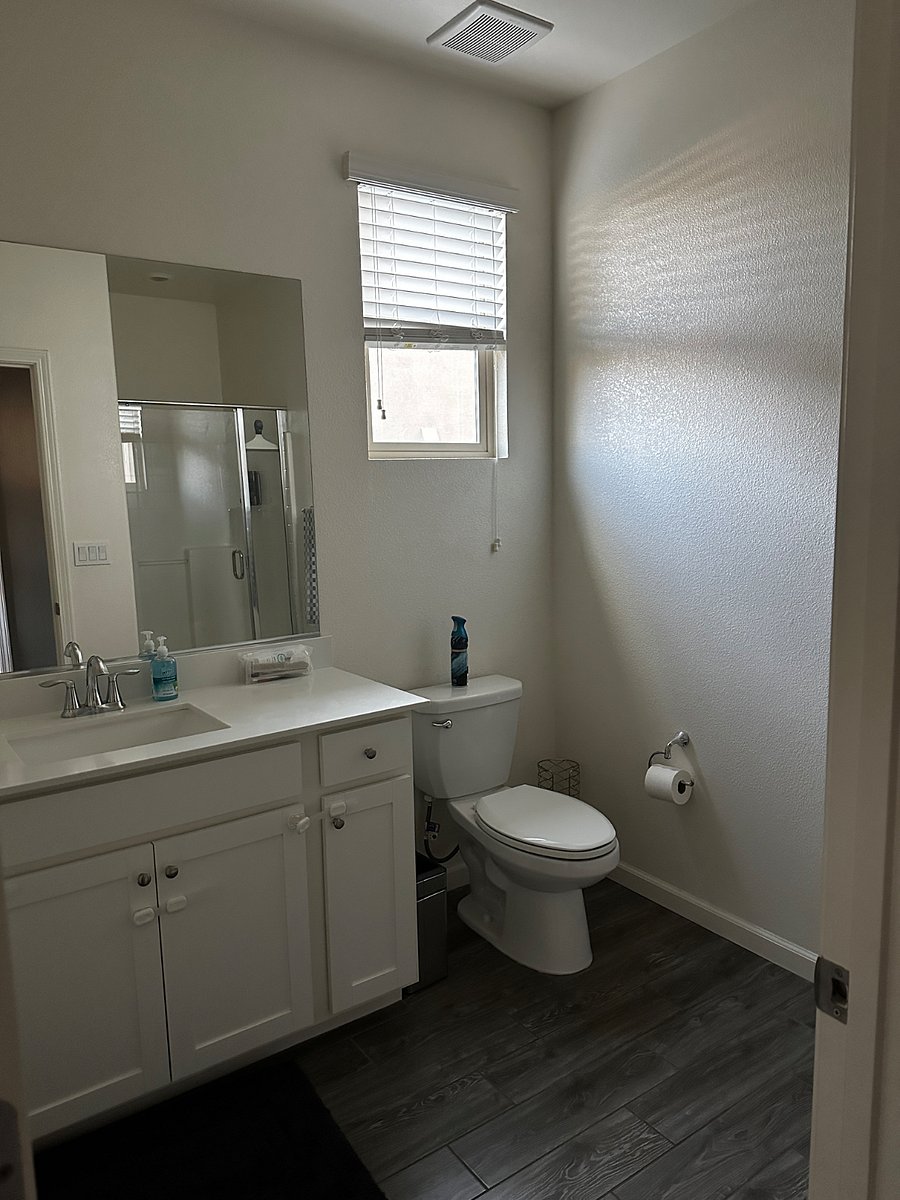 Bathroom: Vanity, Toilet, Shower, starter toiletries
