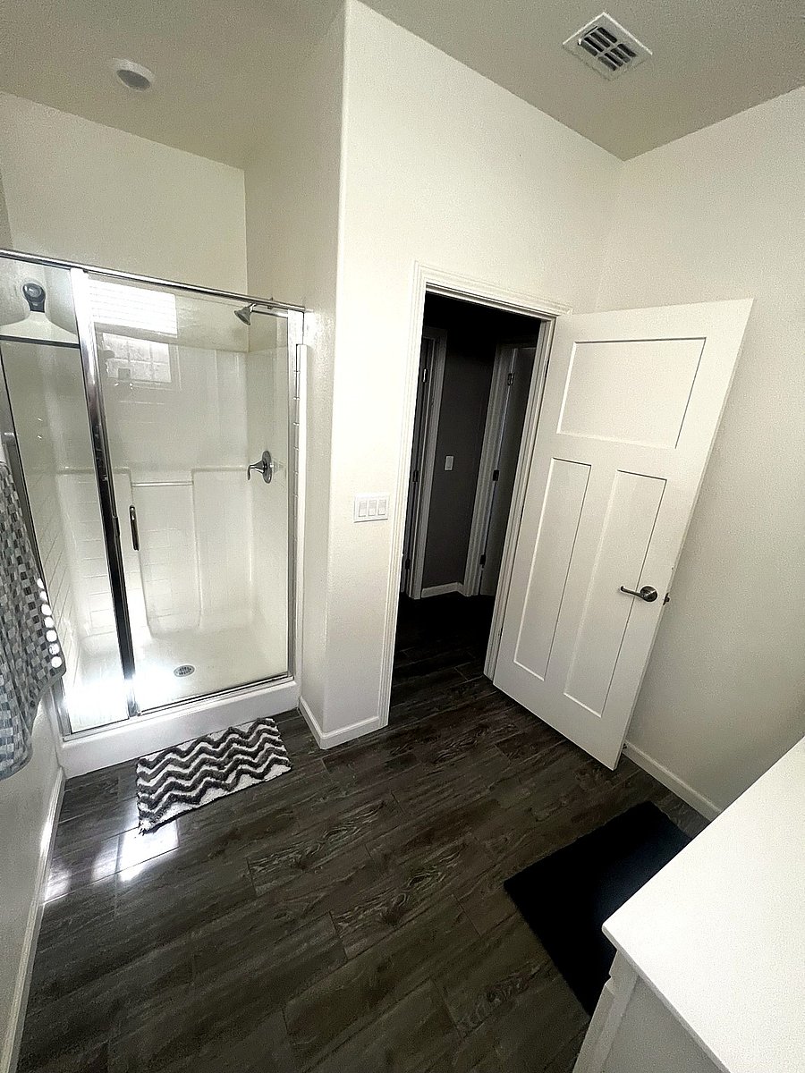 Bathroom: Vanity, Toilet, Shower, starter toiletries