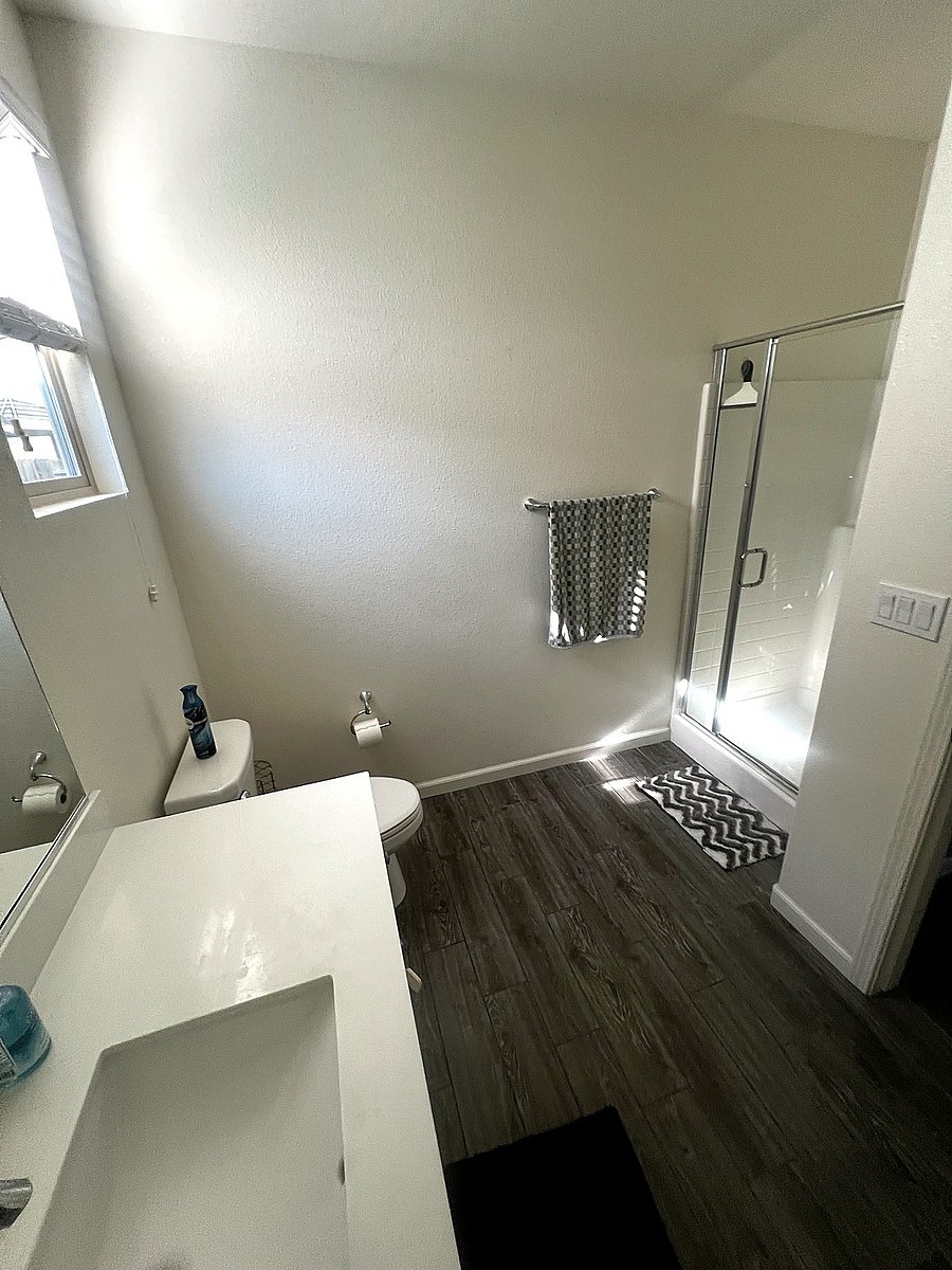 Bathroom: Vanity, Toilet, Shower, starter toiletries