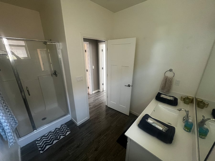 Bathroom: Vanity, Toilet, Shower, starter toiletries