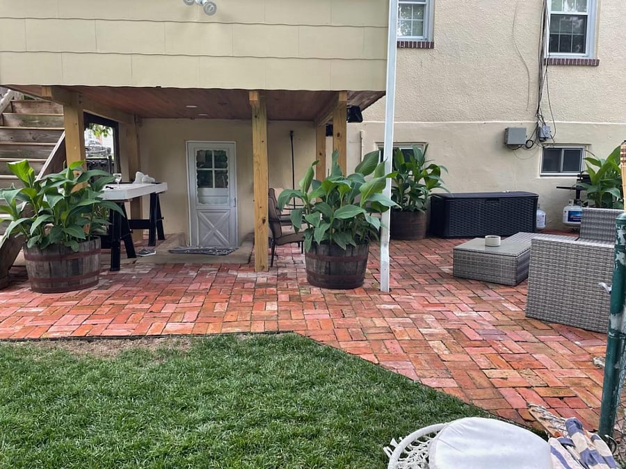 Yard with grill and seating, which tenants have access to.