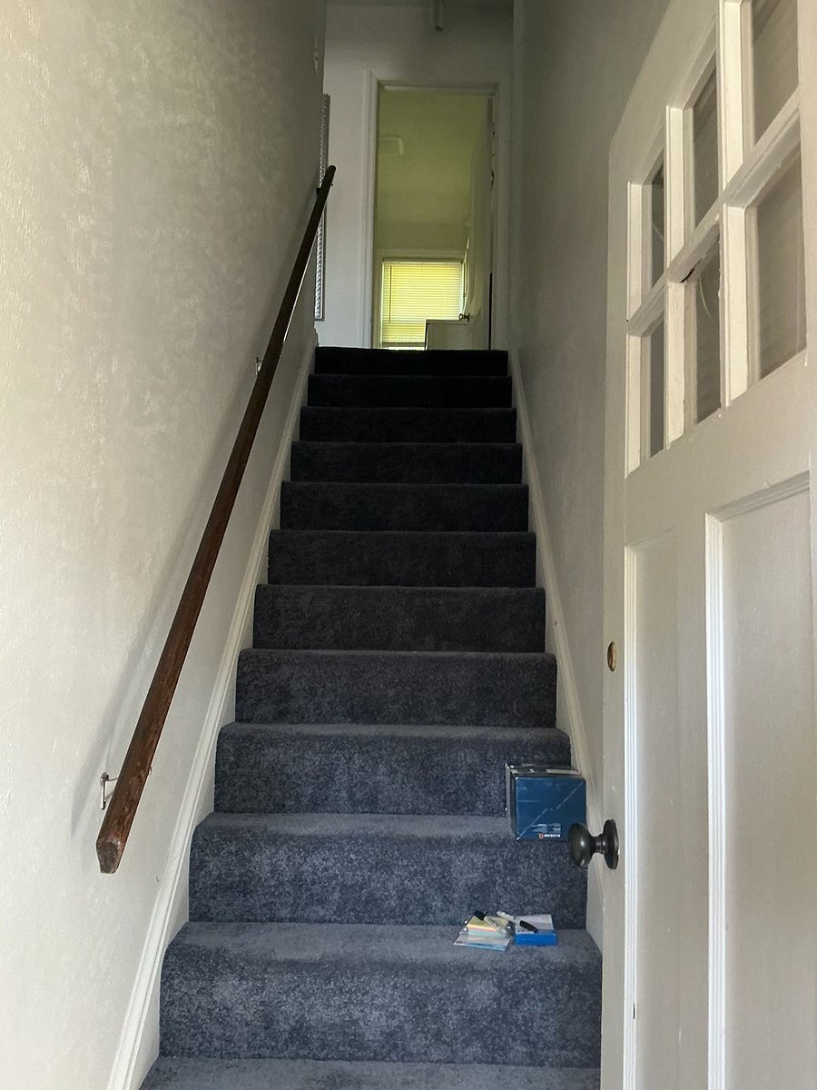 Stairs at entrance to upper unit.
