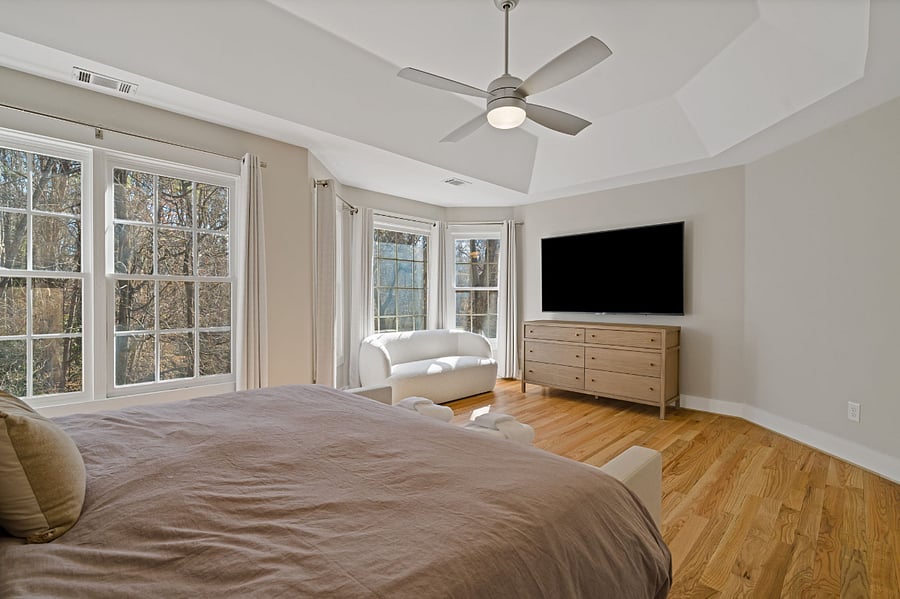 Master Bedroom with sofa and 77in Smart TV