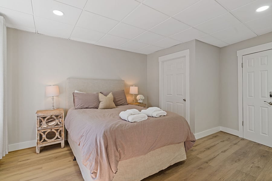 Queen bedroom in basement