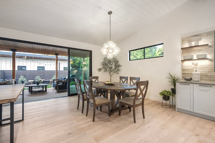 Large glass sliding doors that open to the back patio