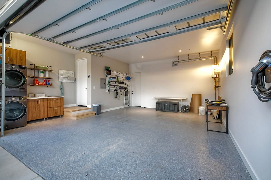 The garage includes an EV charger along with a washer and dryer