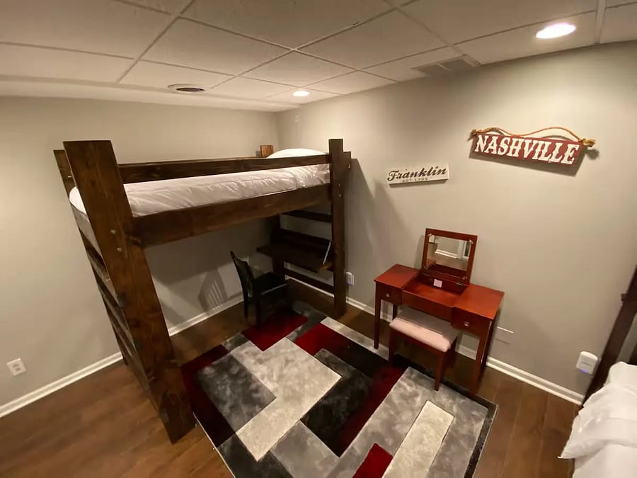 Bunk-bed room, sleeps 3.
Large sturdy loft (on the left), with underneath desktop/lamp work area/chair,
Nice wooden vanity with chair, drawer, left-up center desk (with mirror) for makeup, etc.