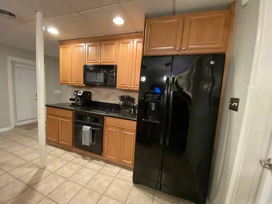 Full size kitchen with granite counter-top, bar-seating/stools, full size-refrigerator, microwave, stove, dishwasher, kitchen sink/disposal, lots of cabinets and kitchen storage stocked with plats, dishes, cups, mugs, sugar/salt/cooking oil, baking sheets, steak-knives/utensils, can-opener, and many many more accessories, coffee maker(s) [Kcup and drip/brew/hot-water boiler], under kitchen sink cleaning supplies/dishwasher soap, and more.