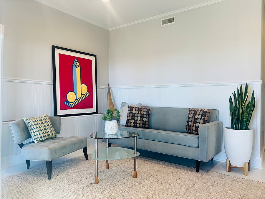 Cozy Couch and Chair in Living Area with Ocean View.