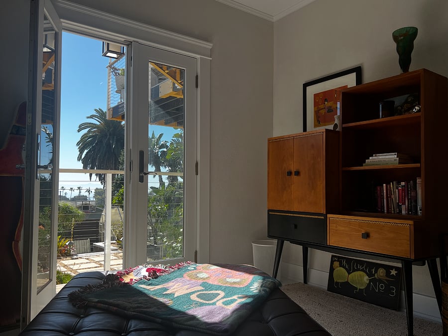 Library/Meditation Room with Leather Chaise and French Doors to Balcony with View. Could be a Bedroom instead.