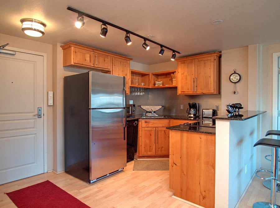 Kitchen with granite counters and counter bar