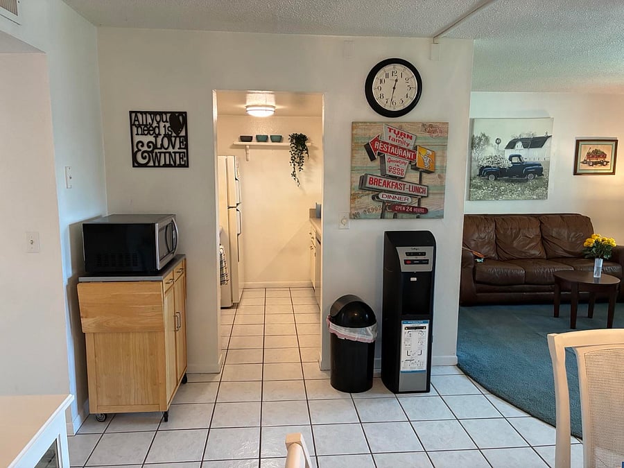Photo from dining area to kitchen and living room