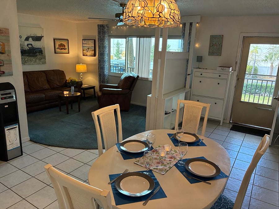 Dining table with chairs for 6 people, open to living room