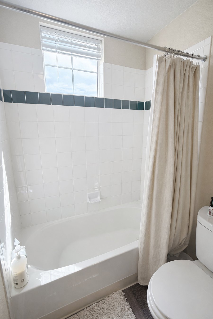 Downstairs shower with natural light and updated shower head