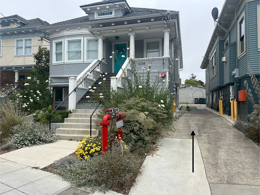The front of the property, a 3-unit building, and driveway to the back of the property, where the Hideaway