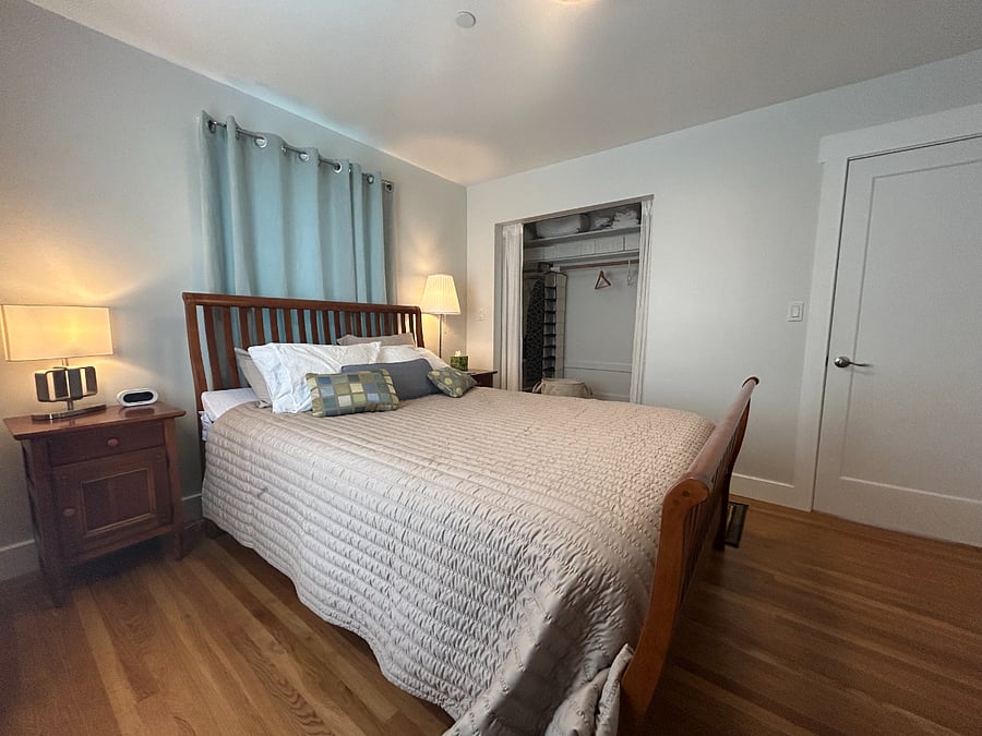 Bedroom with spacious closet and queen bed