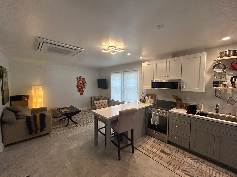 Open concept kitchen/living room with dining peninsula