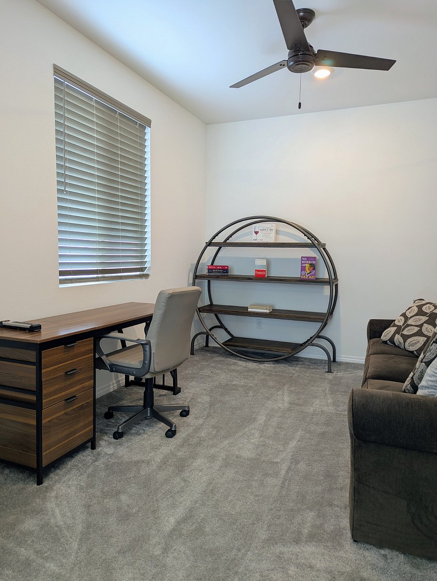 Cozy den 'retreat' off of the bedroom with desk and office chair for work. Cozy couch for relaxation.