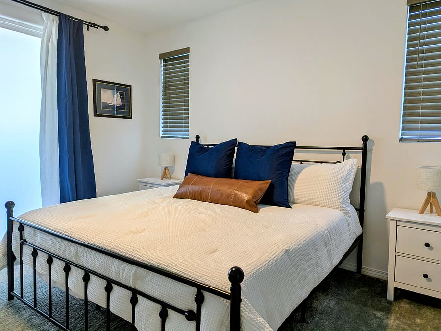 Cozy bedroom suite with king-sized bed, medium-firm hybrid mattress. Room darkening shades and curtains.