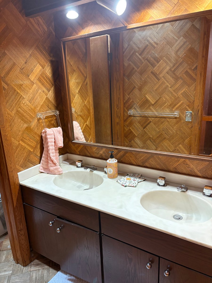 This bathroom goes with the larger room