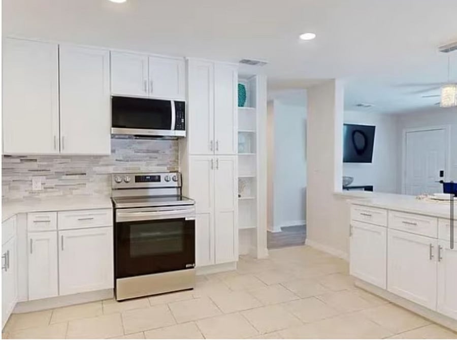 Fully equipped chef-style kitchen with premium stainless steel appliances, smart cooking features, and spacious storage, designed for effortless, everyday living.