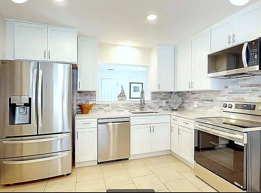 Fully equipped chef-style kitchen with premium stainless steel appliances, smart cooking features, and spacious storage, designed for effortless, everyday living.