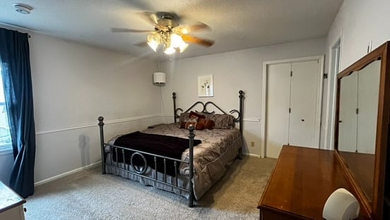 Master bedroom with king bed, attached bath.