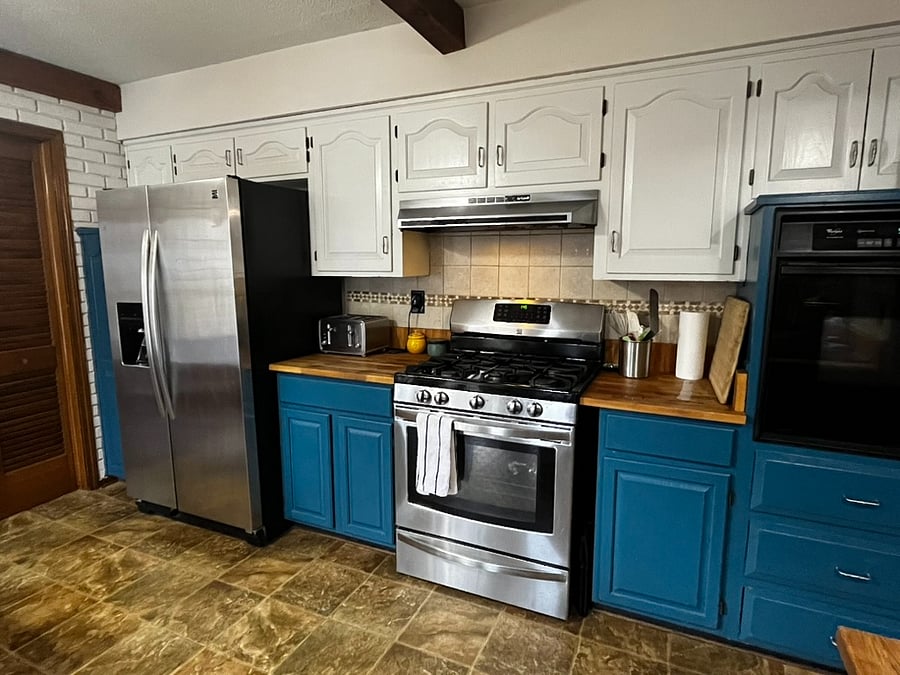 Kitchen with gas stove and oven and extra electric oven.