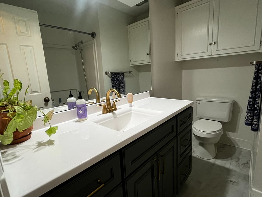 Hall bathroom with tub and shower.