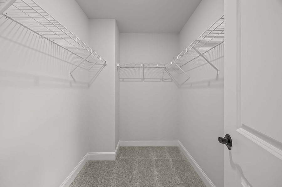 Spacious, walk-in closet with plenty of storage space.