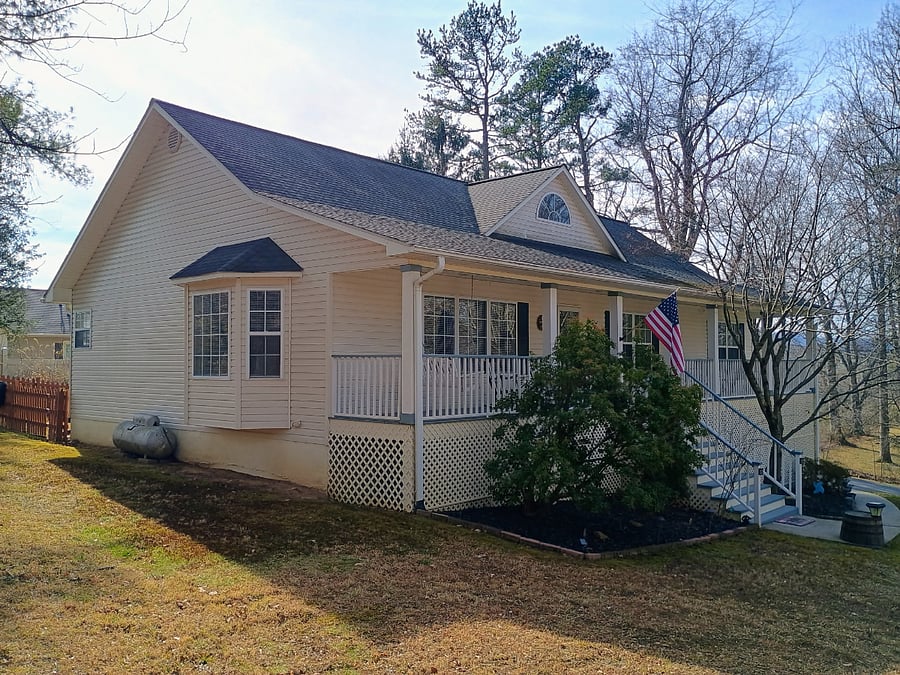 Side view of the house exterior with a clear look at the property layout.