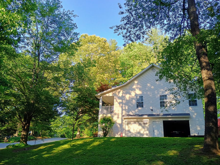 Garage and parking area view (summer).