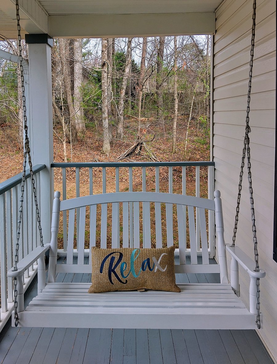 Sit down, relax, and enjoy the beautiful sounds of nature while swaying on the porch swing.