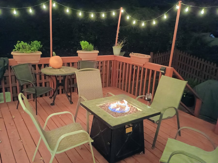 Walk out to the deck from the kitchen. Equipped with a fire pit to warm up on cooler days or make s'mores, plus a few herbs available for tea or cooking.