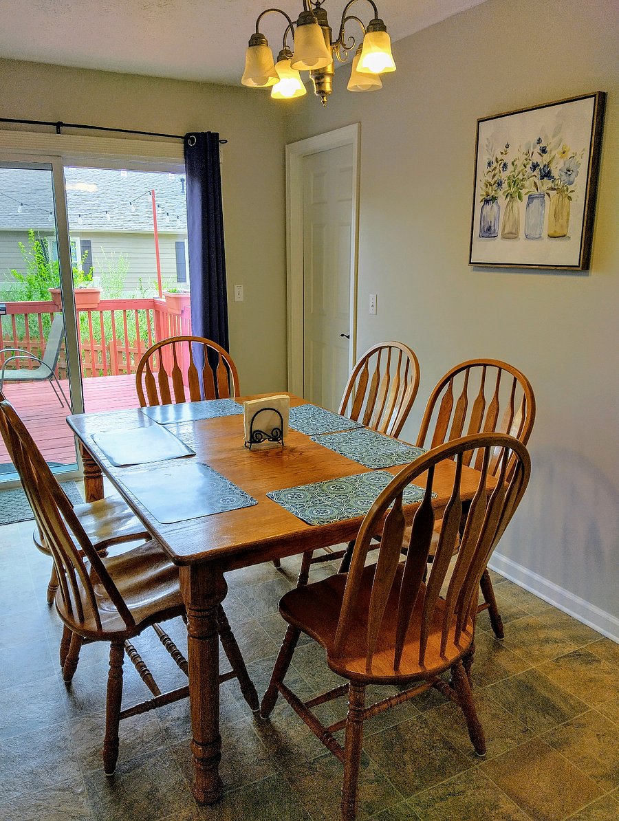 The dining area sits adjacent to the kitchen and seats six people. From this space, you can step directly onto the deck at the back of the house.