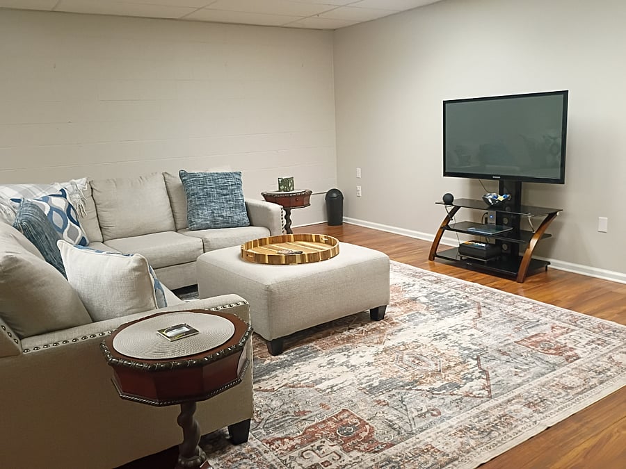 The family room is located in the basement and includes a Smart TV. Because this level is naturally cooler, a portable space heater is provided.