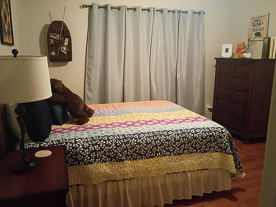 The third bedroom, known as the Bear Room, features a queen-size bed and a chest of drawers.