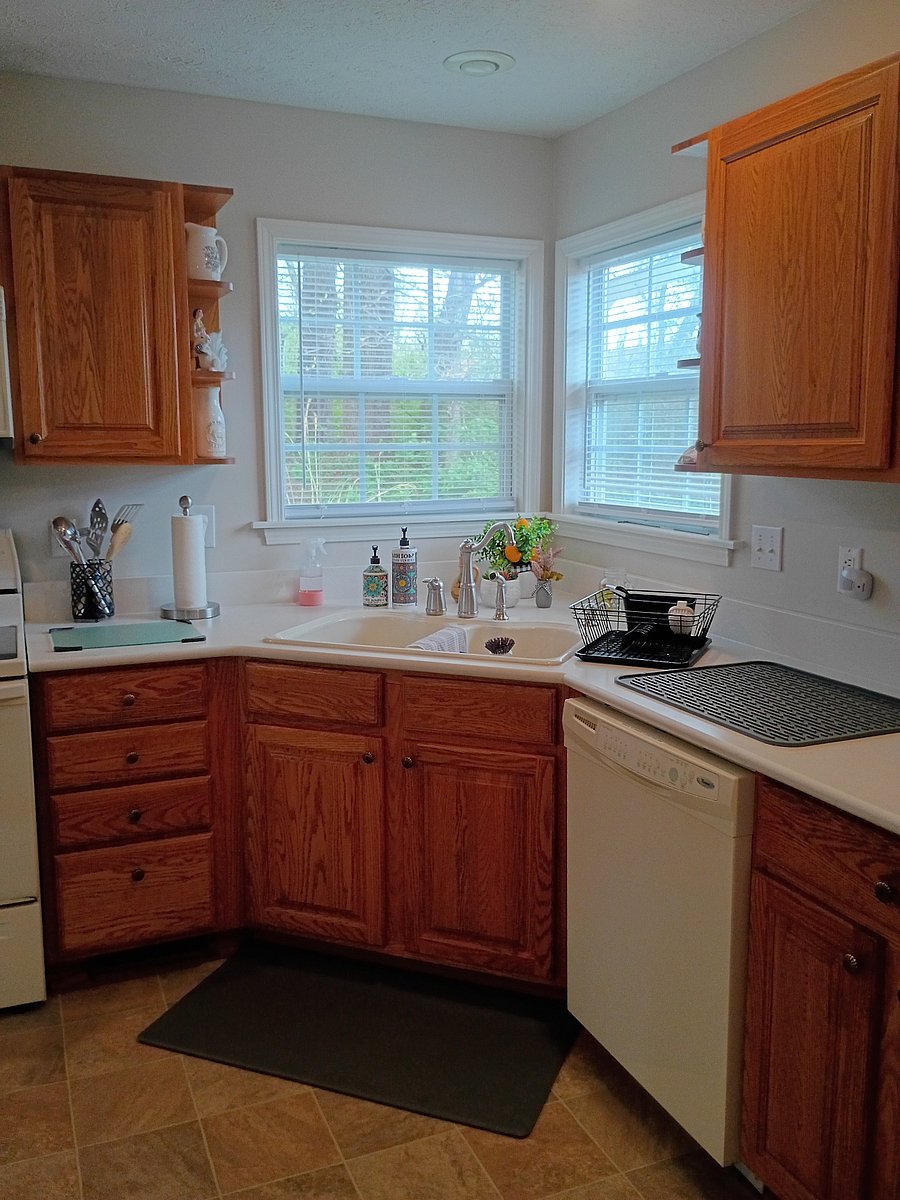 The kitchen is well lit and fully equipped, with many additional small appliances provided.