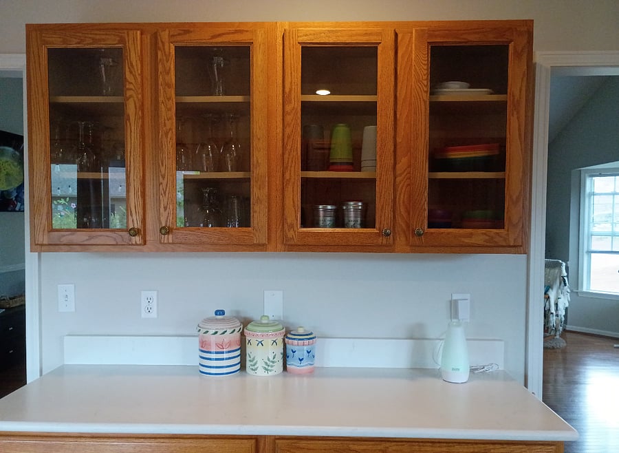 The kitchen's center counter is stocked with plenty of glassware, as well as plastic plates and cups for the kiddos.