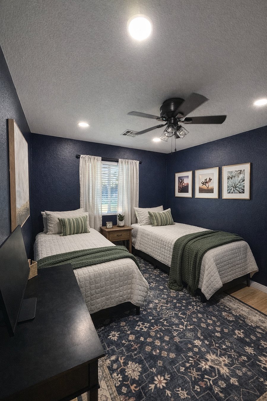 The blue room is our favorite! With two twin beds, this room also doubles as a dedicated office. Weve provided a desk with keyboard and monitor. Hook up your laptop and youre all set!