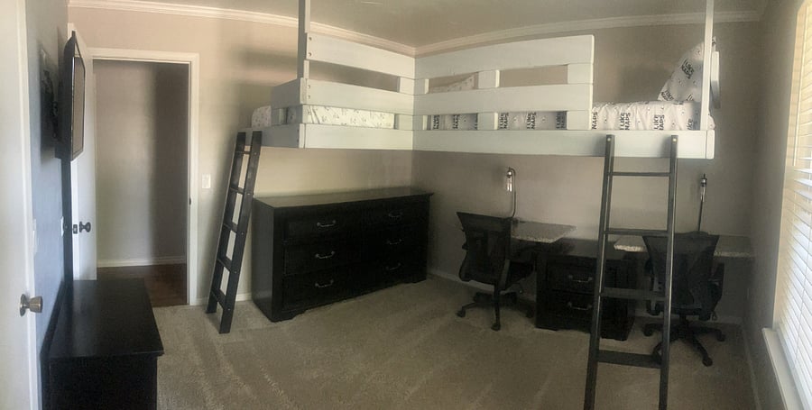 Bedroom 1: Two twin size loft Beds with two desks 