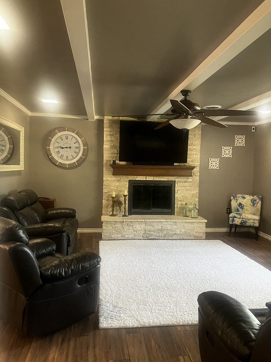 Living room with smart tv and plenty of seating