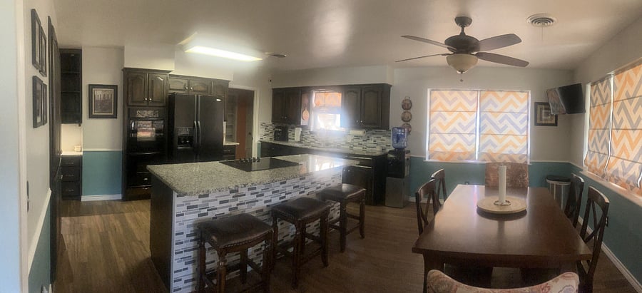 Kitchen with bar that seats three