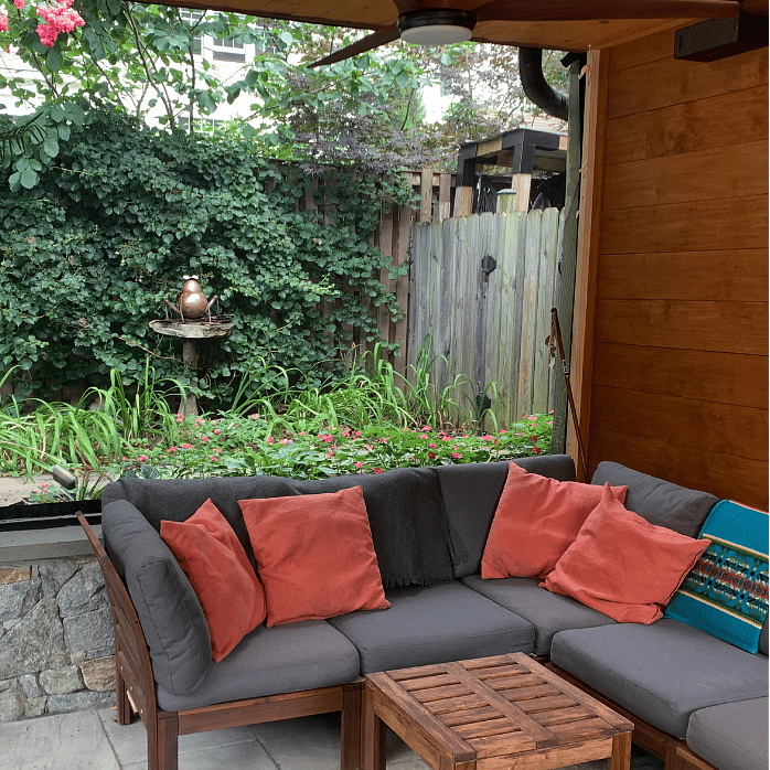 Pergola is screened in summertime.