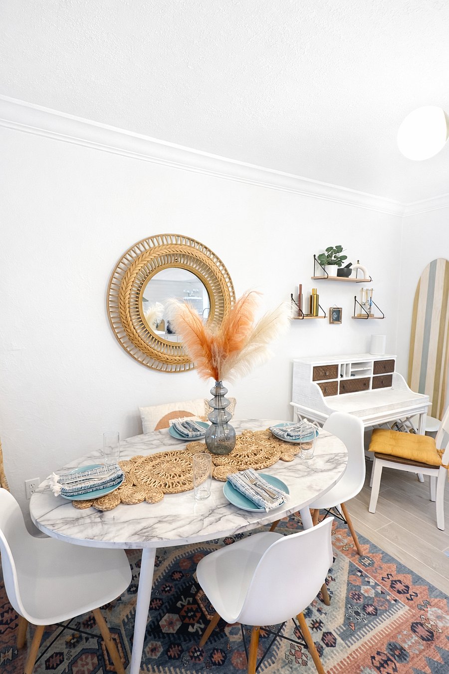 Stylish dining area with a table set for four, perfect for shared meals, morning coffee, or gathering after a day out.
