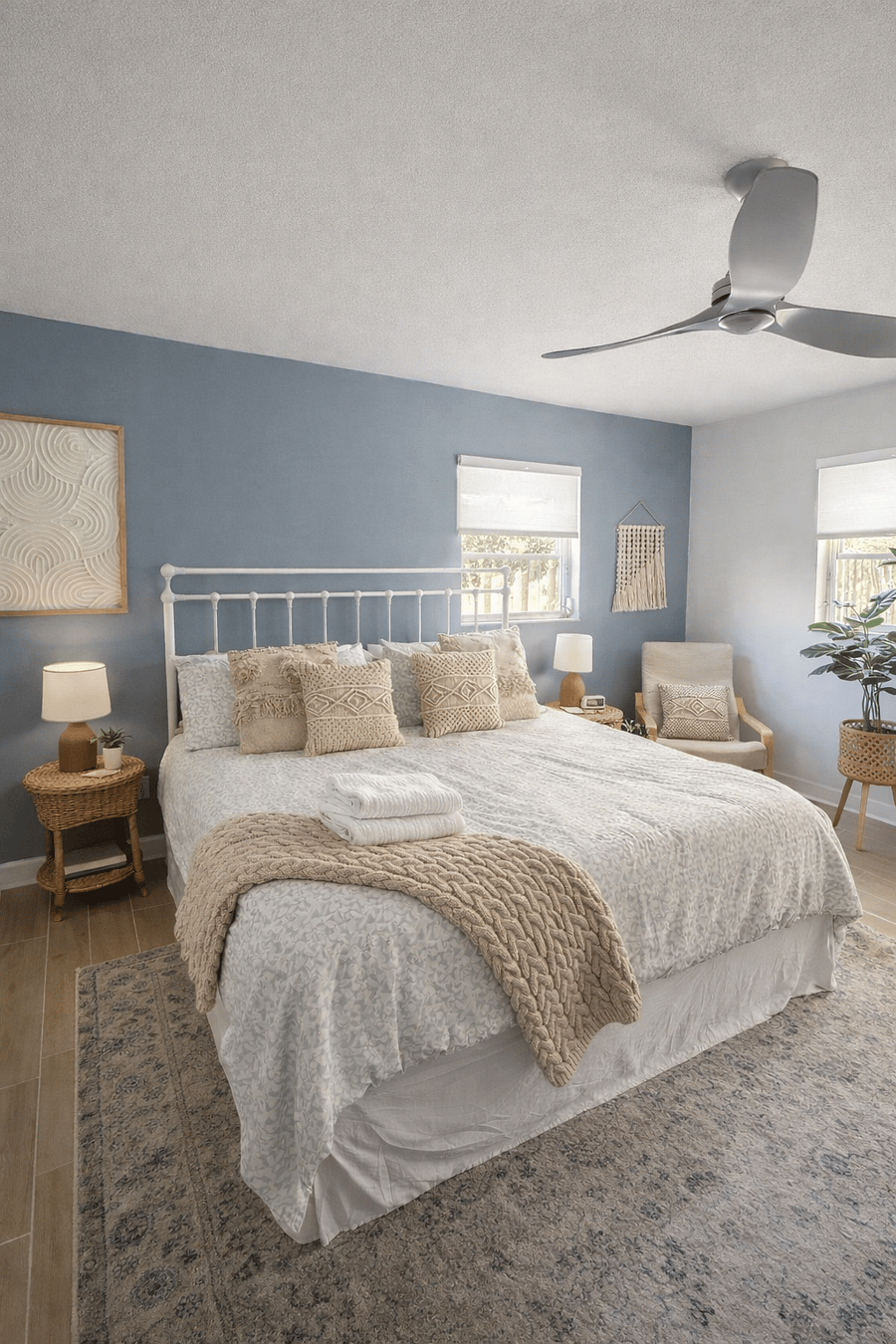 Serene master suite with a king bed, soft linens, and calming coastal dcor. Designed for comfort and relaxation, perfect for unwinding after a full day.