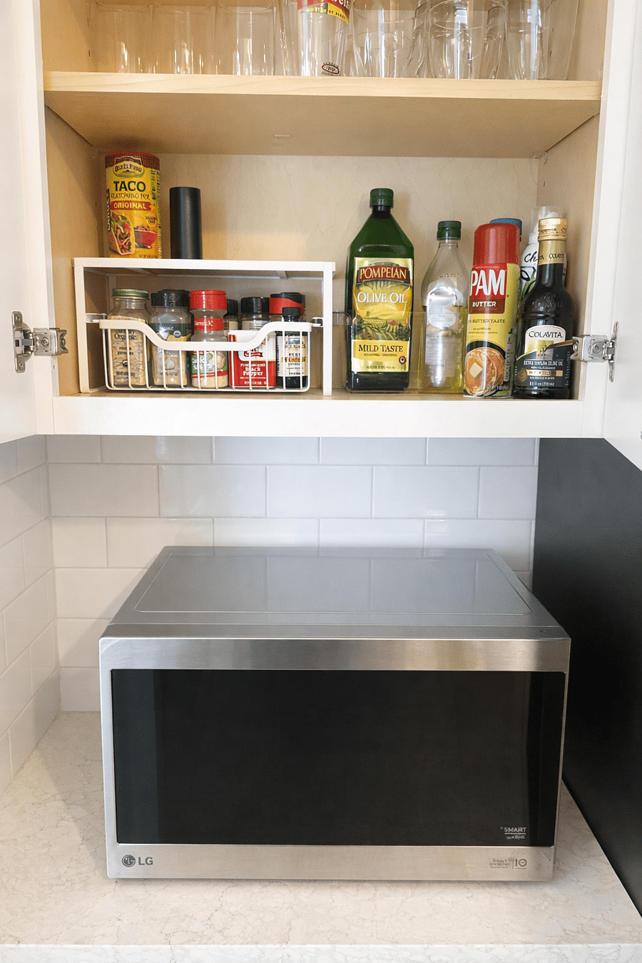 Fully stocked kitchen essentials with microwave, cooking oils, spices, and glassware, making it easy to prepare meals during your stay.