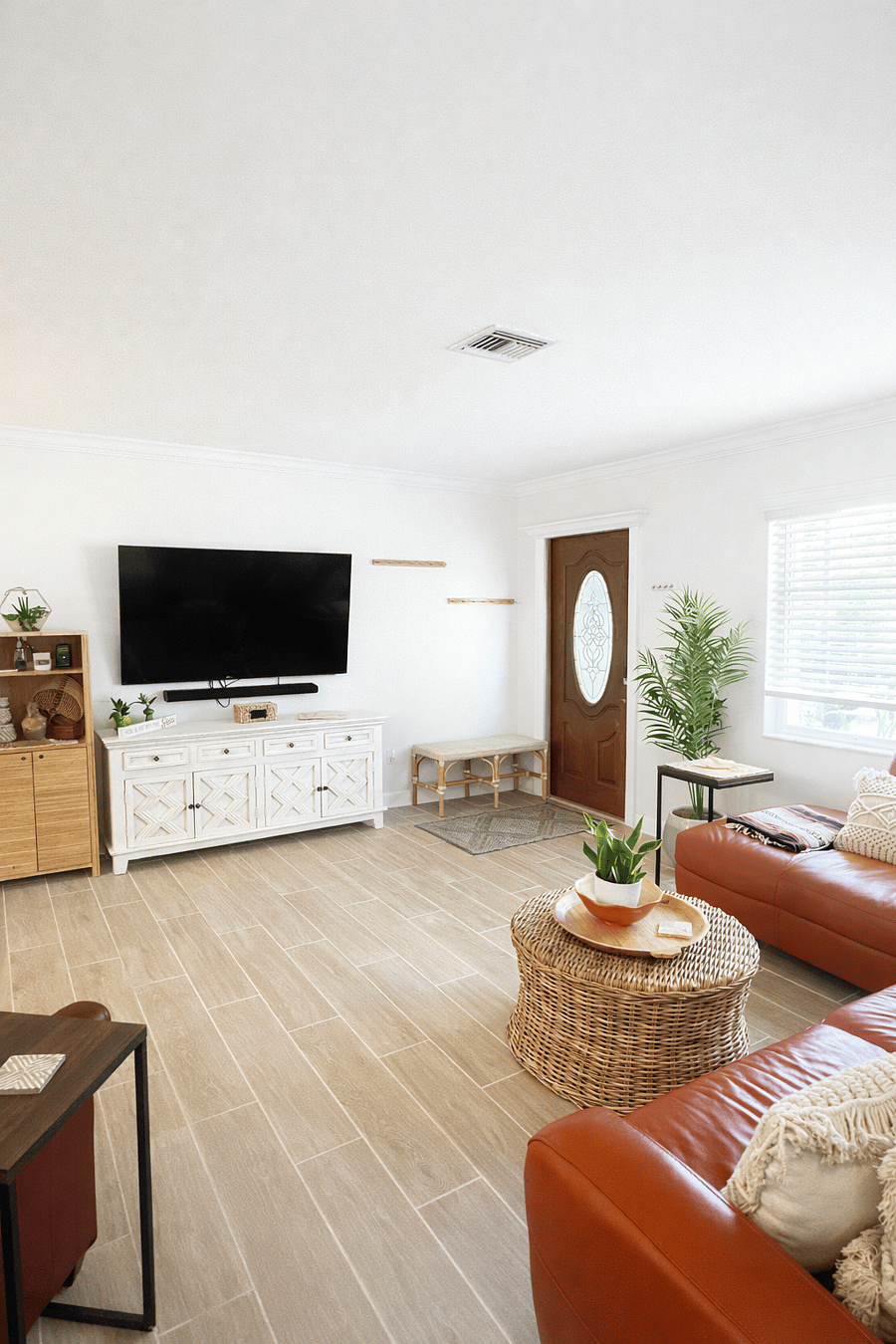 Bright living room with a comfortable sectional, smart TV, and plenty of natural light. A cozy space to relax, watch movies, and unwind together after a day out.